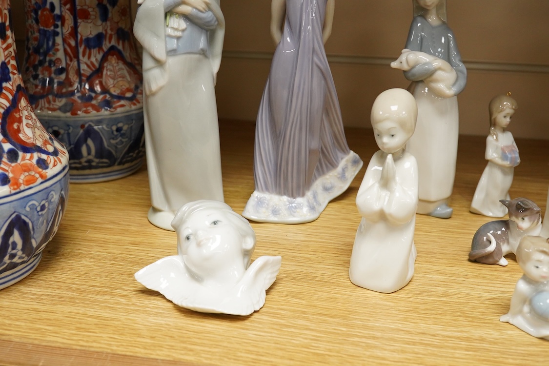 A group of twelve Lladro figures/animals, tallest 23cm